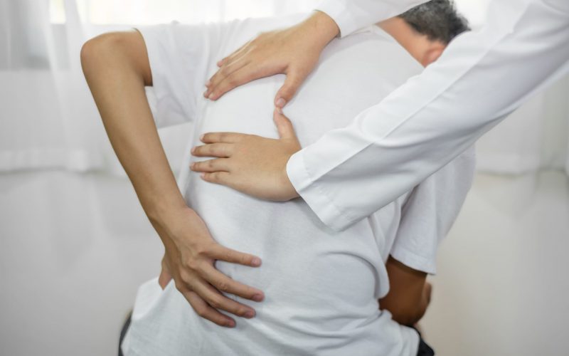 Female,Physiotherapists,Provide,Physical,Assistance,To,Male,Patients,With,Back